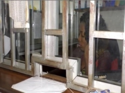 At this business, the cashier is present but can not work without electricity in Yaounde, Cameroon, Aug 16, 2019. (Photo: Moki Kindzeka)