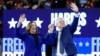 US Vice President and 2024 Democratic presidential candidate Kamala Harris and her running mate Minnesota Governor Tim Walz wave to the crowd after speaking at a campaign rally at the Fiserv Forum in Milwaukee, Wisconsin, August 20, 2024. (AP/Jacquelyn Martin)