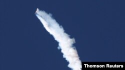 The Ascent Abort-2 of NASA's Orion spacecraft's emergency launch abort system separates after lift off during a flight test from the Cape Canaveral Air Force Station in Florida, July 2, 2019.