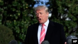 President Donald Trump speaks to reporters before leaving the White House, Nov. 21, 2017, in Washington, for a Thanksgiving trip to his Mar-a-Lago estate in Palm Beach, Fla. Silent for more than a week, Trump all but endorsed embattled Alabama Republican Senate nominee Roy Moore, discounting the sexual assault allegations against him.