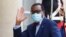FILE - President of the African Development Bank, M. Akinwumi Adesina waves as he arrives for a dinner with French President Emmanuel Macron and leaders of African states and international organisations on the eve of a summit on aid for Africa, at Elysee 