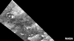 Hundreds of sand dunes are visible as dark lines snaking across the surface.