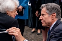 U.S. Secretary of State Antony Blinken, right, speaks with Holocaust Survivor Margot Friedlander, at the Memorial to the Murdered Jews of Europe in Berlin, June 24, 2021.