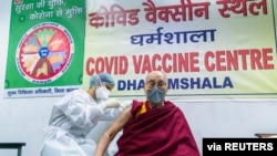 Tibetan spiritual leader, the Dalai Lama, receives a dose of coronavirus disease (COVID-19) vaccine at a vaccination centre in Dharamsala, India, March 6, 2021. (Office of his holiness the Dalai Lama/Handout via Reuters)