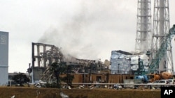 Smoke is seen coming from the area of the No. 3 reactor of the Fukushima Daiichi nuclear power plant in Tomioka, Fukushima Prefecture in northeastern Japan on Mar 21 2011