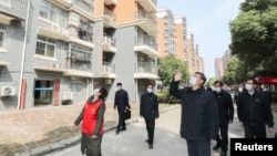 Presiden China Xi Jinping saat mengunjungi Wuhan dan mendeklarasikan “Perang Rakyat” terhadap virus corona, Selasa (10/3). 