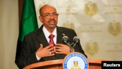 FILE - Sudan President Omar al-Bashir speaks to the media in state house in capital Juba during his visit to South Sudan.
