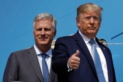 FILE - U.S. President Donald Trump and National Security Adviser Robert O'Brien board Air Force One at Los Angeles International Airport, Sept. 18, 2019.