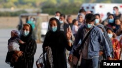 FILE - People who have been evacuated from Kabul arrive at Naval Station (NAVSTA) Rota Air Base in Rota, southern Spain, August 31, 2021.