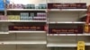 Empty shelves and signs on the soft drinks aisle of a Sainsbury's store in Rowley Regis in the West Midlands, England, July 22, 2021.