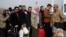 Syrian migrants wait to cross into Syria after Syrian rebels ousted President Bashar al-Assad, at Cilvegozu border gate in Hatay province, Turkey, Dec. 11, 2024.