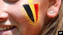FILE - A Belgium fan waits for the group G match between Belgium and Tunisia at the 2018 soccer World Cup in the Spartak Stadium in Moscow, Russia, June 23, 2018.