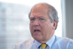 FILE - Special Inspector General for Afghanistan Reconstruction John Sopko speaks during an interview with Agence France-Presse, July 24, 2014, in Arlington, Va.