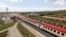 FILE - A general view shows a train on the Standard Gauge Railway line constructed by the China Road and Bridge Corporation and financed by Chinese government in Kenya, Oct. 16, 2019. 