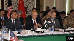 In this handout photograph released by the Associated Press of Pakistan (APP) on February 6, 2016, Pakistani officials chair the third round of four-way peace talks with Afghan, Chinese and U.S. delegates in Islamabad.