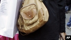 August 30: An Indian villager throws a fishing net into the River Brahmaputra at Suwalkuchi, India. (AP Photo/ Anupam Nath)