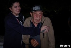 Local resident Vyacheslav, 71, reacts as he waits for news about his wife, daughter and granddaughter, who were in a residential building hit by a Russian missile strike in Kharkiv, Ukraine, on May 31, 2024.