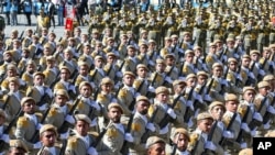 FILE - Iranian army troops march in a parade marking National Army Day just outside Tehran, Iran, April 17, 2016. A new force was announced Thursday, designed to fight in Arab countries and would recruit heavily from non-Iranian Shi'ite Muslims across the region.