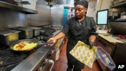 Johkiya Pierre prepares a fresh omelet at The Breakfast Brothers restaurant, Feb. 12, 2025, in Arlington, Texas.