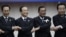 From left: South Korea's President Lee Myung-bak, China's Premier Wen Jiabao, Cambodia's Prime Minister Hun Sen and Japan's Prime Minister Yoshihiko Noda hold hands together during the ASEAN Plus Three (APT) Commemorative Summit in Phnom Penh, Cambodia, N