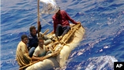 FILE - Cuban refugees float in heavy seas 60 miles south of Key West, Florida, Aug. 26, 1994.