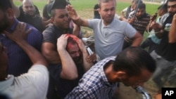 FILE - Palestinian Hamas militants transport Yarden Bibas to Gaza after kidnapping him from his home in Nir Oz, a kibbuz in Israel near the Gaza border, on Oct. 7, 2023.