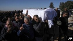 Members of the Bedouin community carry the body of Yosef Al Zaydani, who was in Hamas captivity in the Gaza Strip, a day after the Israeli army said his body was recovered in a tunnel in Gaza, during his funeral in Rahat, Israel, Jan. 9, 2025.