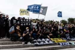 People gather for a rally to mark the second anniversary of the protests in Hong Kong, in Union Square in New York City, June 12, 2021.