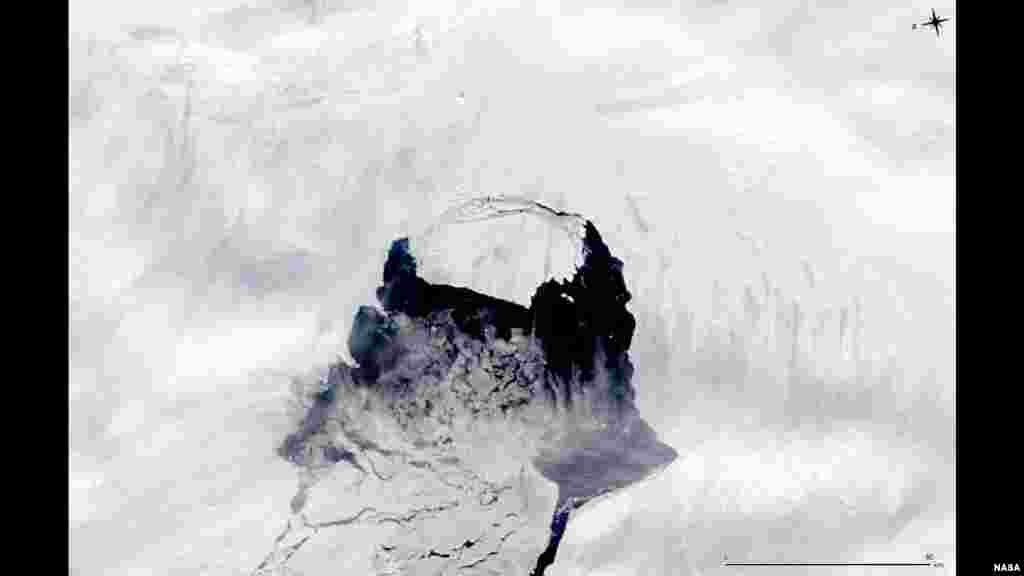 Gambar oleh satelit Aqua NASA menunjukkan gunung es yang dahulu merupakan bagian dari Glacier &#39;Pine Island&#39; dan sekarang memisahkan diri dari benua Antartika.