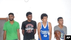 From left to right, Mohamed Kassim, Faraj Swaleh, Ali Omar and Kassim Ali at the Mombasa law court, March 7, 2016, after they were arrested by Kenya police, allegedly attempting to leave the country to join extremist group Islamic State in Libya.