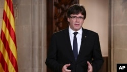 Catalan President Carles Puigdemont speaks in Barcelona, Spain, on Oct. 4, 2017. On Oct. 9, 2017, Puigdemont asked Catalan leaders to back down in their support of an independence referendum.