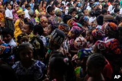 Children line up to enter school on Gardi Sugdub island off Panama's Caribbean coast on May 27, 2024.