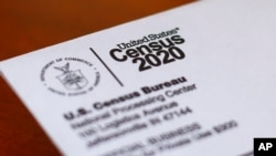 FILE - This photo shows an envelope containing a 2020 census letter mailed to a U.S. resident in Detroit, April 5, 2020.