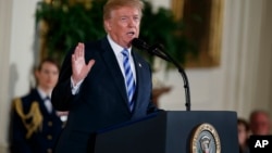 President Donald Trump speaks during the Public Safety Medal of Valor awards ceremony in the East Room of the White House, Feb. 20, 2018, in Washington.