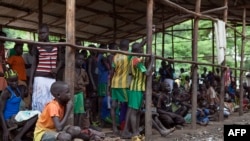 Children displaced by the fighting in South Sudan wait to be registered at a refugee camp in Ethiopia.
