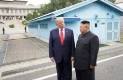 U.S. President Donald Trump meets with North Korean leader Kim Jong Un at the demilitarized zone separating the two Koreas, in Panmunjom, South Korea, June 30, 2019.