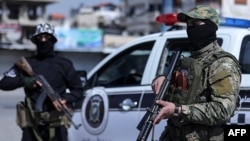 Syrian forces man a checkpoint in the coastal city of Latakia on March 8, 2025. (Syrian Arab News Agency via AFP)