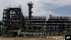 FILE - The Dangote refinery opens in Lagos, Nigeria, on May 22, 2023. Oil accounts for 95% of Nigeria's foreign exchange earnings, making the Dec. 13 COP28 deal to "transition away" from fossil fuels difficult to accept for many Nigerian leaders.