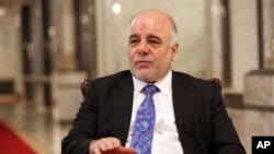 FILE - Iraqi Prime Minister Haider al-Abadi is seen speaking to the media.