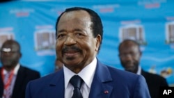 FILE - Paul Biya, of the Cameroon People's Democratic Movement party, waits to cast his vote during the presidential elections in Yaounde, Oct. 7, 2018.