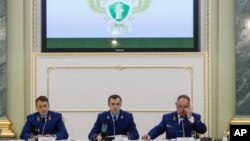 Aides from the Russian Prosecutor General office attend a news conference in Moscow, Russia, Nov. 19, 2018, announcing new charges against U.S.-born investment banker Bill Browder.