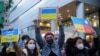 Demonstrators hold placards as they take part in a rally against Russia's invasion of Ukraine, in Taipei, Taiwan February 25, 2022.