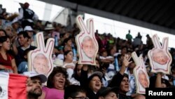 Supporters of Mexican presidential candidate Andres Manuel Lopez Obrador gather at a closing campaign rally at Azteca stadium, in Mexico City, Mexico, June 27, 2018.