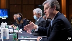 美情报界主管在参议院情报委员会就世界范围的威胁举行的听证会上作证。从左至右为：国家安全局局长中曾根、国家情报总监海恩斯、中央情报局局长伯恩斯和联邦调查局局长克里斯托弗·雷。 (2021年4月14日)