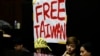 FILE - Students protesting against a China-Taiwan trade pact occupy the legislature floor, in Taipei, Taiwan, March 20, 2014.