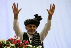 FILE - Afghan President Ashraf Ghani campaigns for re-election at a rally in Kabul, Afghanistan, Sept. 13, 2019.