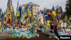 A war veteran visits a makeshift memorial for fallen Ukrainian soldiers at Independence Square in Kyiv, Ukraine, March 5, 2025. 