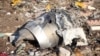 FILE - Debris of a plane belonging to Ukraine International Airlines that crashed after taking off from Iran's Imam Khomeini airport, is seen on the outskirts of Tehran, Iran, Jan. 8, 2020. 