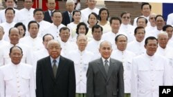 Cambodia's King Norodom Sihamoni, second right, poses for photograph altogether with Hun Sen, right, Cambodian Prime Minister, Chea Sim, second left, Cambodia Senate President, Heng Samrin, left, Cambodian National Assembly President, in front of the National Assembly in Phnom Penh, Cambodia, Wednesday, Sept. 24, 2008.