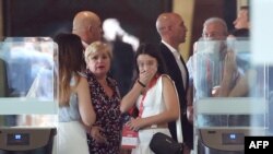 Spain's football federation president Luis Rubiales (C), his mother Angeles Bejar (L) and his father Luis Rubiales (R) leave after an extraordinary general assembly of the federation on Aug. 25, 2023 in Las Rozas de Madrid.